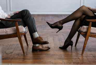 man and woman legs sitting down for initial consultation